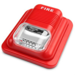 Red manual fire alarm call point with a clear protective cover and the word FIRE on top, designed to be pressed in an emergency.